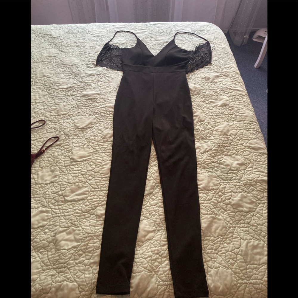 Black jumpsuit never worn still has tags.